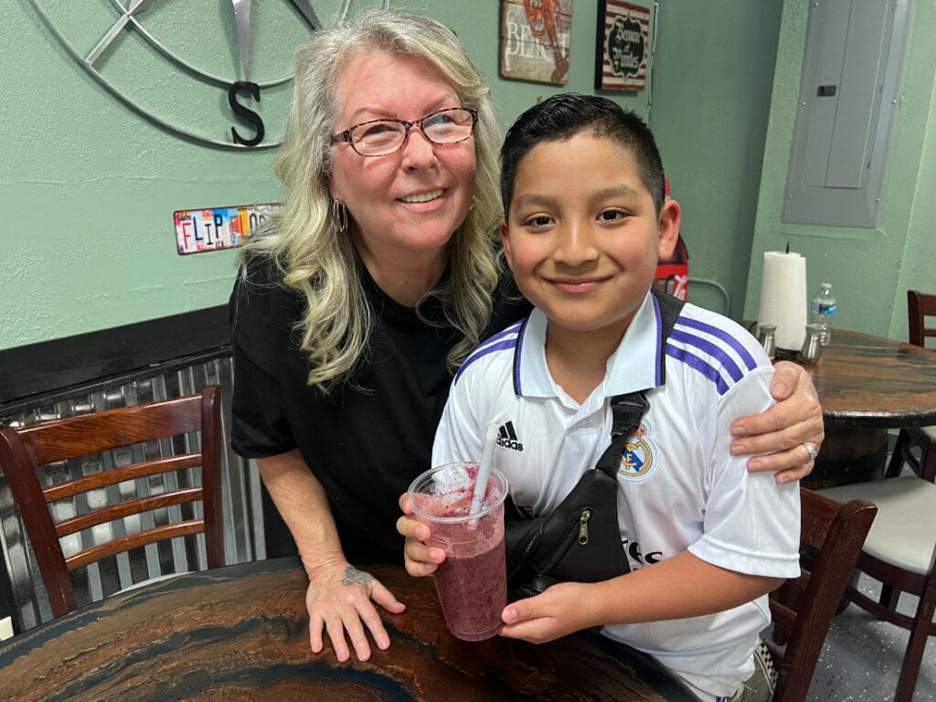 Sheila (Owner) With a happy repeat customer who loves the smoothies.